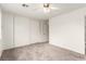 Bedroom features neutral carpet, ceiling fan, and closet with sliding doors at 4416 Rip Van Winkle Ln, Las Vegas, NV 89102