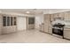 Open kitchen area with tile flooring, modern appliances, and lots of cabinet space at 4416 Rip Van Winkle Ln, Las Vegas, NV 89102