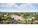 Expansive aerial view showcases a golf course community with lush landscaping and stunning desert views at 4908 Winterset Dr, Las Vegas, NV 89130