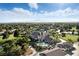 An aerial shot shows a community featuring a pool, golf course, and well-maintained landscaping at 4908 Winterset Dr, Las Vegas, NV 89130