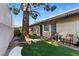 Cozy backyard features lush artificial grass and a shaded area for outdoor relaxation at 4908 Winterset Dr, Las Vegas, NV 89130