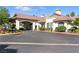 Inviting building with a covered entrance, manicured landscaping and ample parking at 4908 Winterset Dr, Las Vegas, NV 89130