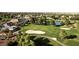 Beautiful aerial view of the lush golf course, a pond, and a swimming pool at 4908 Winterset Dr, Las Vegas, NV 89130