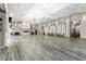 Bright hall with a fireplace, wood floors and elegant lighting fixtures at 4908 Winterset Dr, Las Vegas, NV 89130