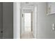 Bright hallway featuring neutral walls and flooring, connecting various rooms within the home at 4908 Winterset Dr, Las Vegas, NV 89130