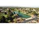 Aerial view of the pond in a golf community with well manicured green space around at 4908 Winterset Dr, Las Vegas, NV 89130