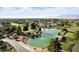 Scenic view of a community pond with a fountain, lush landscaping, and walking paths at 4908 Winterset Dr, Las Vegas, NV 89130
