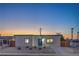 Charming single-story home at dusk showcasing its modern design and landscaping at 5200 Blanton Dr, Las Vegas, NV 89122
