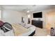 Spacious bedroom with a ceiling fan, large dresser, and comfortable bed at 5617 Craftsman Ave, Las Vegas, NV 89122