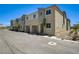 A row of townhomes showcases well-maintained landscaping and convenient garage access at 5617 Craftsman Ave, Las Vegas, NV 89122