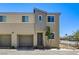 Charming two-story townhome featuring a private garage and modern architectural details at 5617 Craftsman Ave, Las Vegas, NV 89122