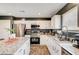 Modern kitchen with granite countertops, stainless steel appliances, and ample cabinet space at 5617 Craftsman Ave, Las Vegas, NV 89122