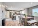 Open layout showcasing the kitchen, dining area, and modern stainless steel appliances at 5617 Craftsman Ave, Las Vegas, NV 89122