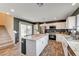 Bright kitchen with a central island, stainless steel appliances, and stylish finishes at 5617 Craftsman Ave, Las Vegas, NV 89122