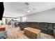 Open-concept living space with modern flooring flowing into the kitchen and dining area at 5617 Craftsman Ave, Las Vegas, NV 89122