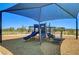 Community playground featuring shade canopy, slide and climbing area for neighborhood children at 5617 Craftsman Ave, Las Vegas, NV 89122