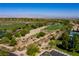 Expansive aerial view of the golf course community in a desert landscape with city views at 6 Yorkridge Ct, Henderson, NV 89052