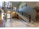 Grand foyer with soaring ceilings, elegant staircase, and abundant natural light at 6 Yorkridge Ct, Henderson, NV 89052