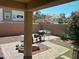 Outdoor patio area with decorative pavers, landscaping, and private brick wall surround at 7064 Coventry Glenn Rd, Las Vegas, NV 89148