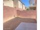 Fully-fenced backyard featuring low maintenance stone and concrete at 8089 Windmill Villa St, Las Vegas, NV 89139