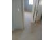 Bedroom with carpeted floors leading into the hall on the tile floor at 8089 Windmill Villa St, Las Vegas, NV 89139