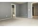 Spacious bedroom with neutral carpet and paint, and an ensuite bathroom at 8089 Windmill Villa St, Las Vegas, NV 89139