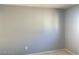 A view of the carpeted bedroom with neutral-colored walls with electrical outlets at 8089 Windmill Villa St, Las Vegas, NV 89139
