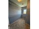 Inside the closet you will find ample space with white metal racks for hanging your clothes at 8089 Windmill Villa St, Las Vegas, NV 89139