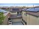 An aerial view shows the home with solar panels, a small balcony and a tile roof at 8325 Winterchase Pl, Las Vegas, NV 89143