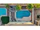 Aerial view of the backyard with a pool, patio, pergola, and mature landscaping at 8325 Winterchase Pl, Las Vegas, NV 89143