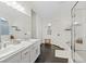 Bright bathroom featuring double sinks, separate tub, and shower at 8325 Winterchase Pl, Las Vegas, NV 89143