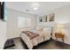 Cozy bedroom featuring stylish wall art and a comfortable bed with a soft throw at 8325 Winterchase Pl, Las Vegas, NV 89143