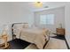 Bright bedroom featuring a comfy bed with elegant linens and a stylish bedside table at 8325 Winterchase Pl, Las Vegas, NV 89143
