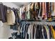 Walk-in closet features plentiful storage, hanging clothes and shelves at 8325 Winterchase Pl, Las Vegas, NV 89143