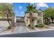 Charming two-story home with desert landscaping, attached two-car garage, and covered entryway at 8325 Winterchase Pl, Las Vegas, NV 89143