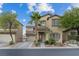 Two-story home with desert landscaping, attached two-car garage, neutral color palette and covered entryway at 8325 Winterchase Pl, Las Vegas, NV 89143