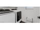 Convenient laundry room with modern washer and dryer units and organized storage at 8325 Winterchase Pl, Las Vegas, NV 89143