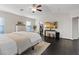 Bright main bedroom features wood floors and a ceiling fan at 8325 Winterchase Pl, Las Vegas, NV 89143