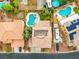 Aerial view of backyard featuring a uniquely shaped pool, garden and well-maintained roof at 8929 Monte Oro Dr, Las Vegas, NV 89131
