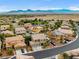 Community aerial view showing houses, desert and mountain views at 8929 Monte Oro Dr, Las Vegas, NV 89131