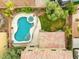 Aerial view showcasing backyard pool, spa, patio, lawn and roof tile at 8929 Monte Oro Dr, Las Vegas, NV 89131