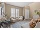 Bright living room boasts wood-look floors, neutral paint, and plantation shutters at 8929 Monte Oro Dr, Las Vegas, NV 89131