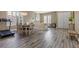 Open concept living room with a dining area and wood-look floors at 8929 Monte Oro Dr, Las Vegas, NV 89131