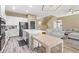 Open concept living space features a kitchen, island with seating, and comfortable living area with a sectional sofa at 8929 Monte Oro Dr, Las Vegas, NV 89131
