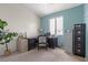Bright home office with a desk, chair, and ample storage cabinets at 8929 Monte Oro Dr, Las Vegas, NV 89131