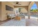 Covered patio with comfortable seating and a view of the sparkling pool at 8929 Monte Oro Dr, Las Vegas, NV 89131