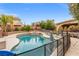 Sparkling swimming pool and spa with a safety fence, perfect for outdoor enjoyment at 8929 Monte Oro Dr, Las Vegas, NV 89131