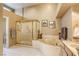 Elegant bathroom featuring separate shower and soaking tub, offering a spa-like experience in the comfort of home at 9201 Yucca Blossom Dr, Las Vegas, NV 89134
