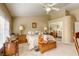 Spacious bedroom featuring a ceiling fan, plush carpeting, and ample natural light from large windows at 9201 Yucca Blossom Dr, Las Vegas, NV 89134
