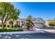 Charming single-story home with manicured lawn, desert landscaping, and a two-car garage at 9201 Yucca Blossom Dr, Las Vegas, NV 89134